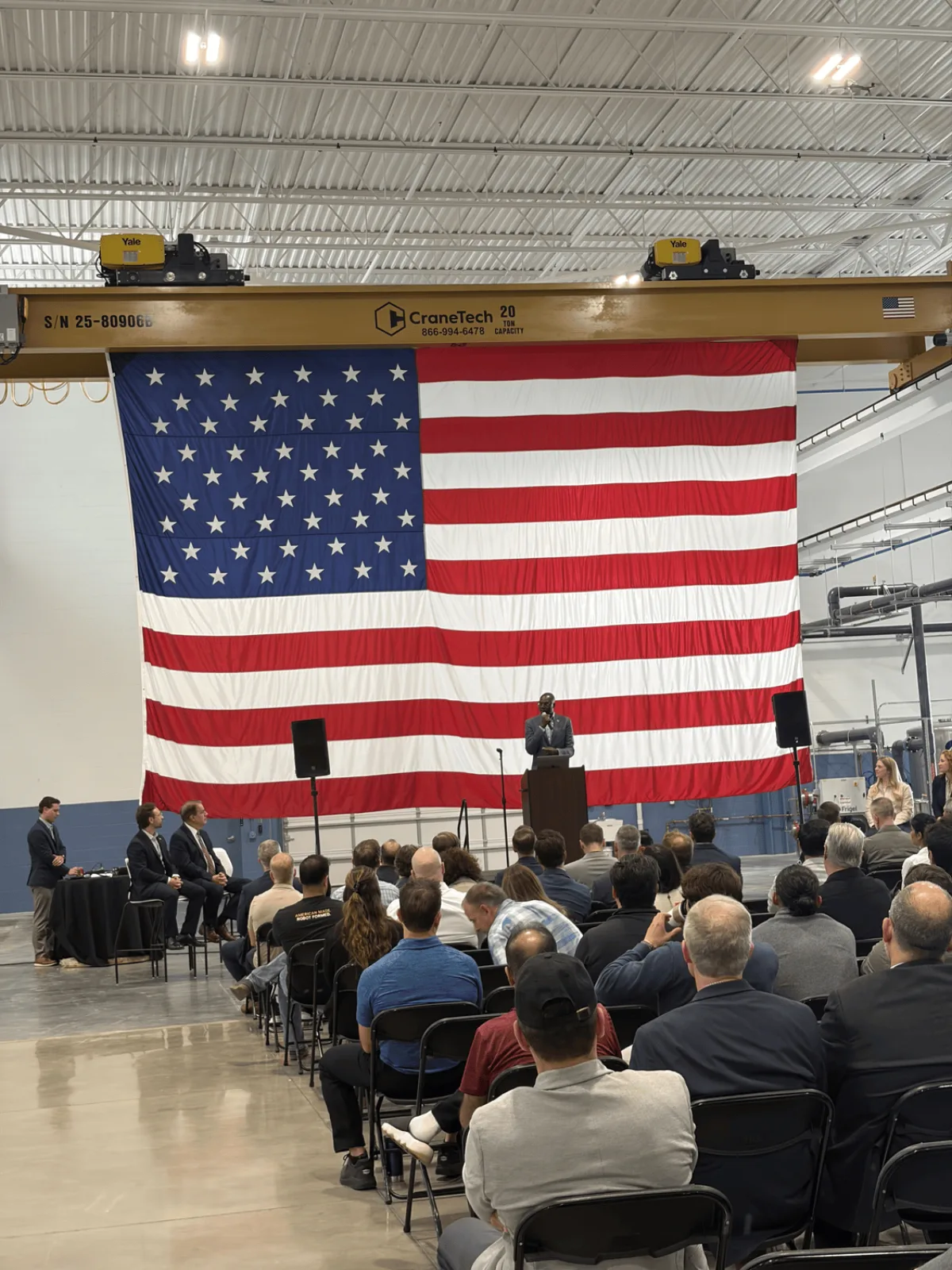 A large United States flag in the summit hall during the keynote