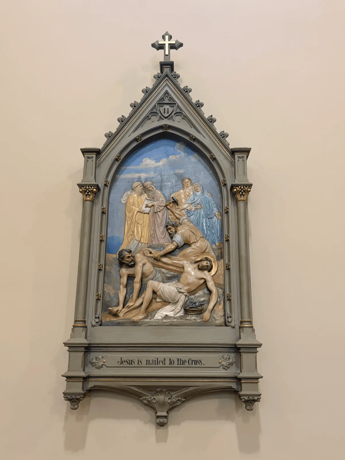 A bronze relief Station of the Cross